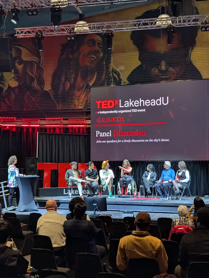 The speaker panel discussion on stage